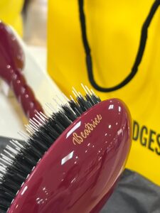 Engraved brush with yellow Selfridges bag